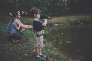 A young boy angling
