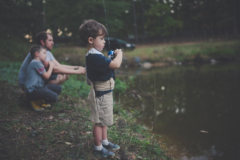 A young boy angling 