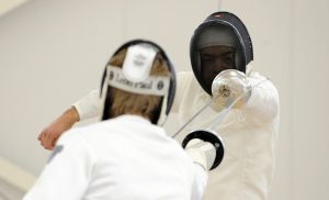 Two people fencing