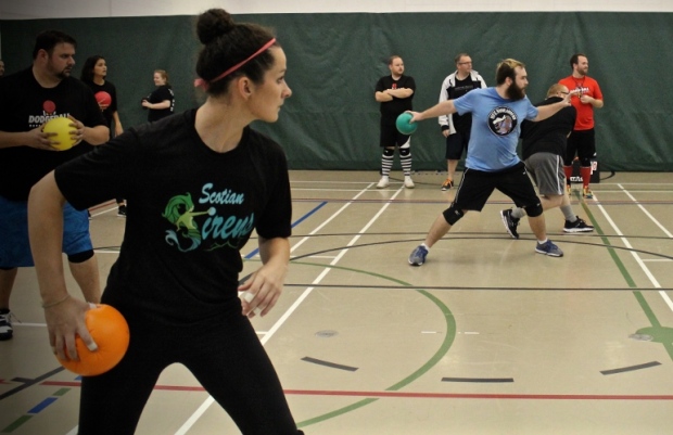 A young lady about to throw a dodgeball 