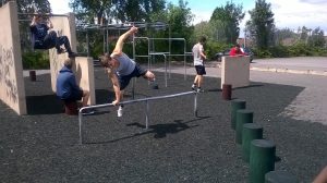 A young man jumping over an obstacle