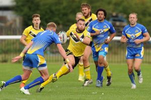 A tackle between two teams