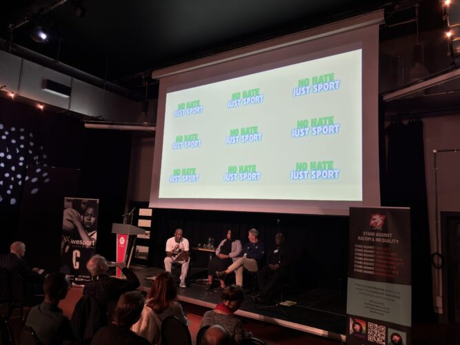 A projection of the No Hate Just Sport logo at the campaign launch event.